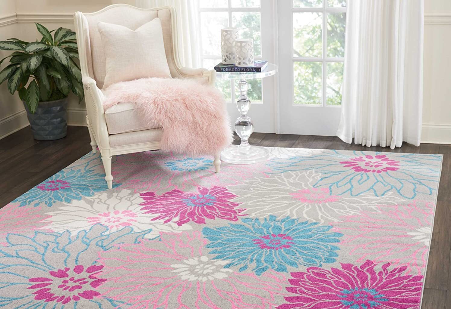 a floral patter area rug in a farmhouse living room