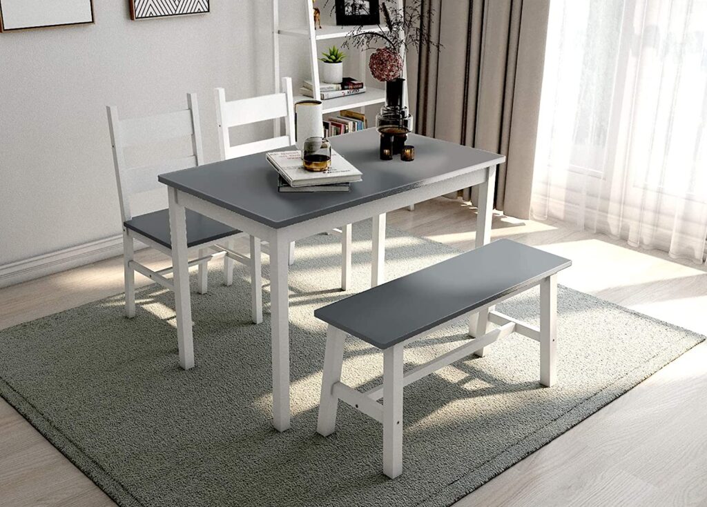 rustic dining table and a couple of chairs in a farmhouse dining room