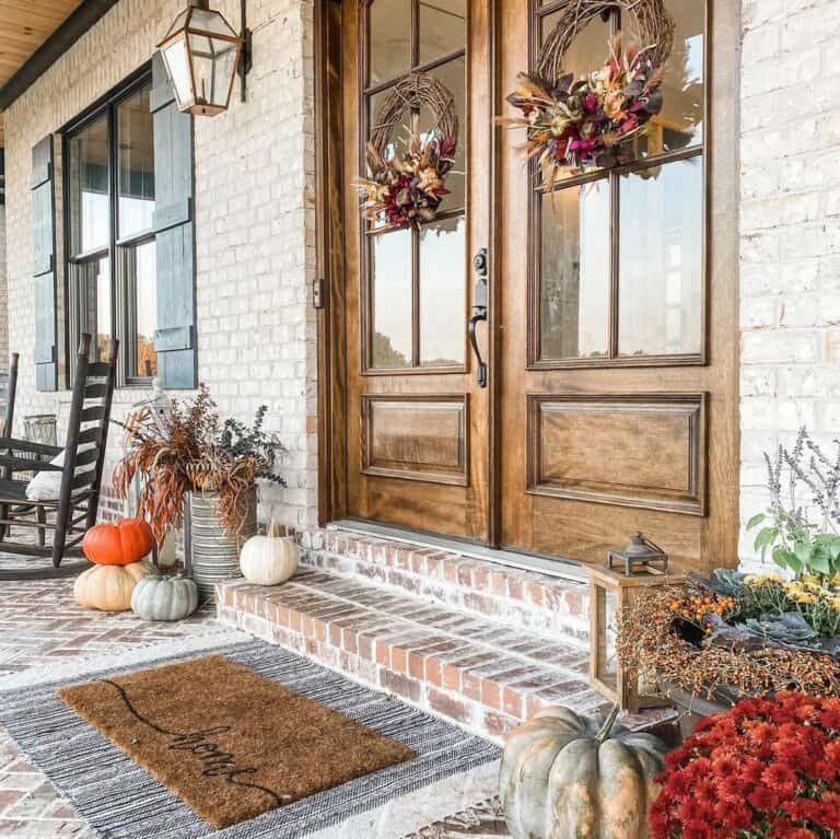 Autumn Elegance: Dual Brown Fall Wreaths on a Brick House