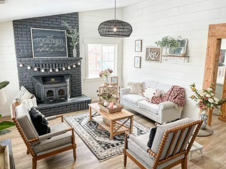 Bohemian Flair in the Farmhouse Living Room with Black Fireplace