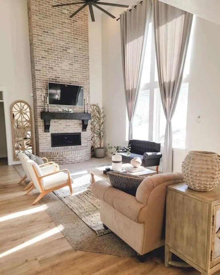 Brick 2-Story Fireplace with Elegant Black Wood Mantel