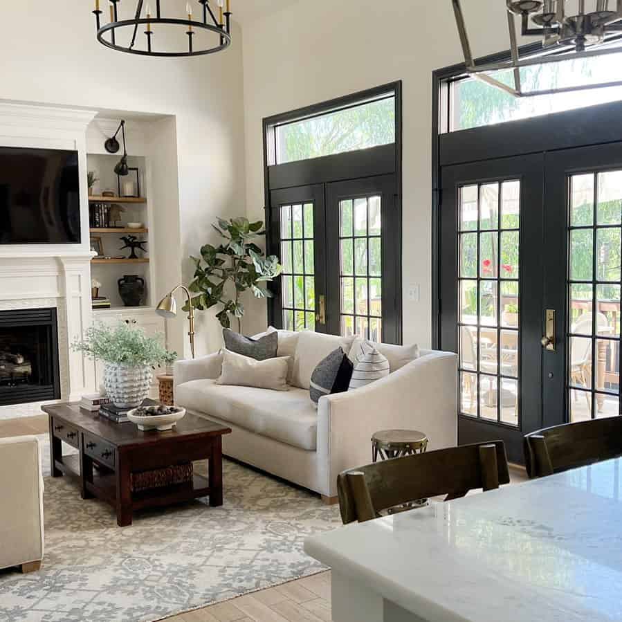 Contemporary Chic: Black French Doors Illuminate the Modern Living Room