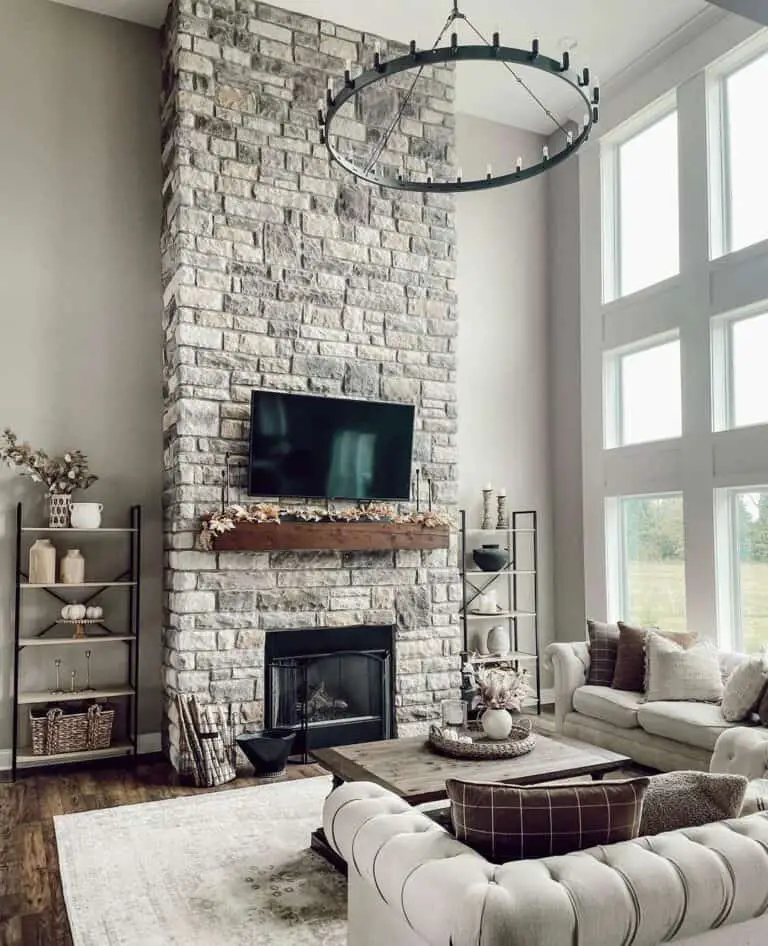 Elegant Gray Stone Two-Story Fireplace with TV Integration
