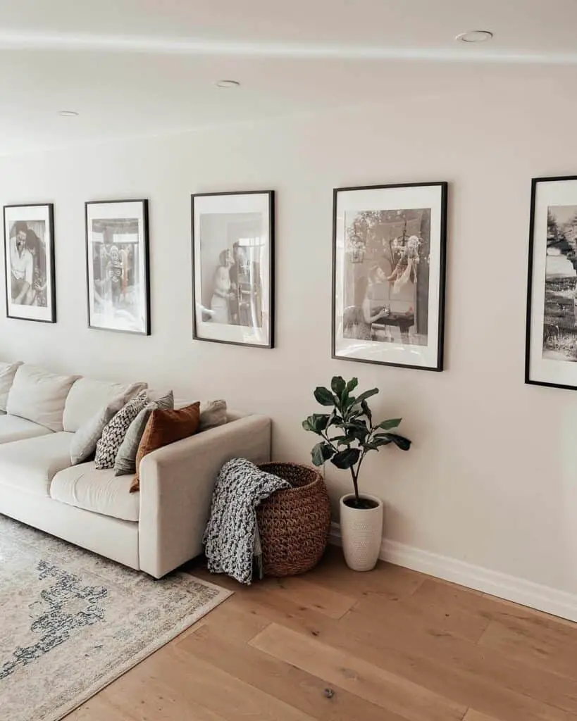 Elevating Beige Living with a Chic Black and White Gallery Wall