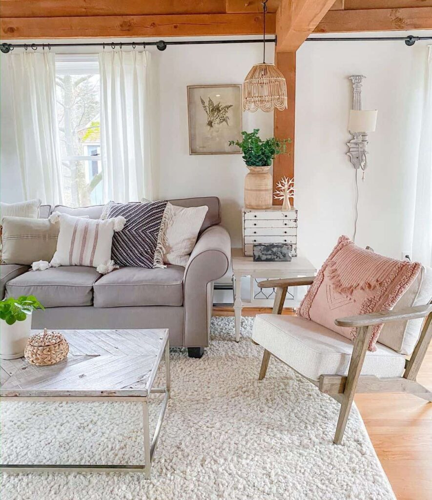 Family Room Featuring a White Herringbone Coffee Table and a Grey Couch