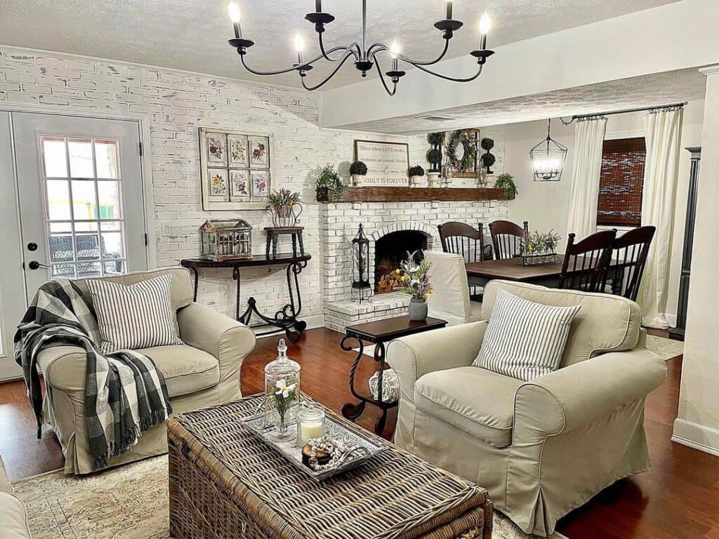 Family Room with a Striking Black Chandelier and Comfortable White Armchairs