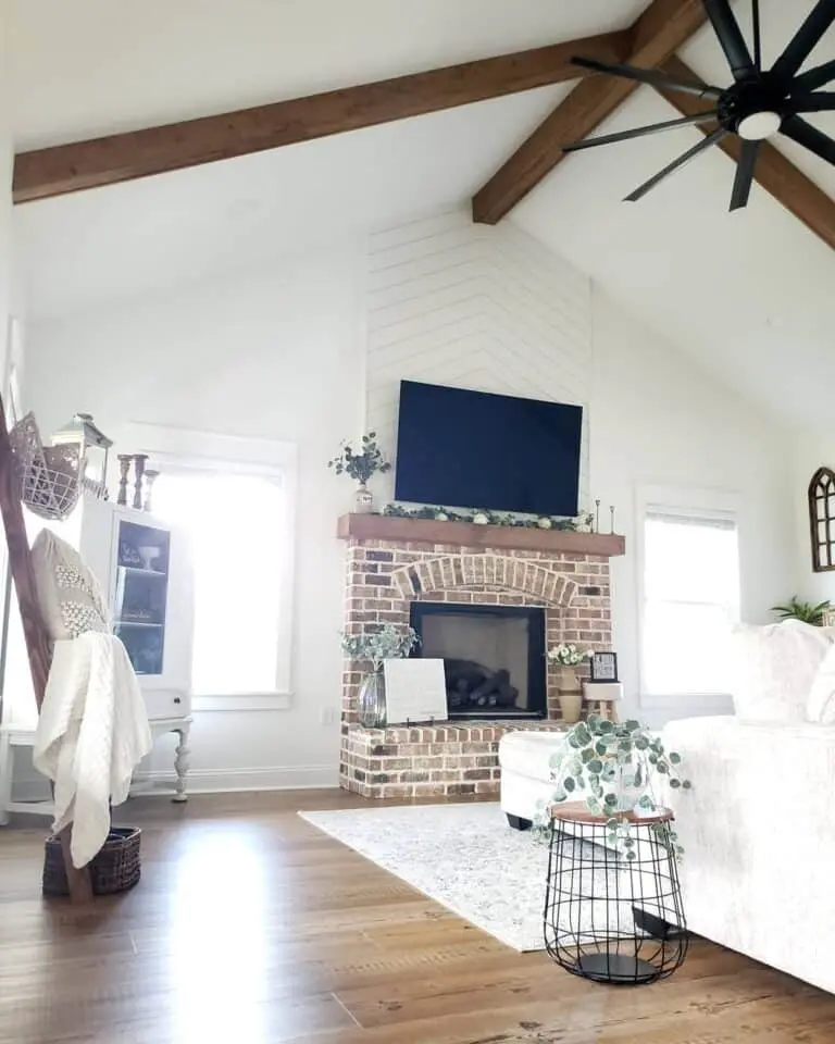 Fireplace Elegance Beneath a Vaulted Ceiling with Chevron Shiplap