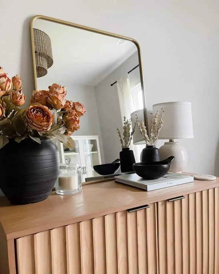 Harmonizing Elements: Black Vases Alongside Contemporary Wood Hutch