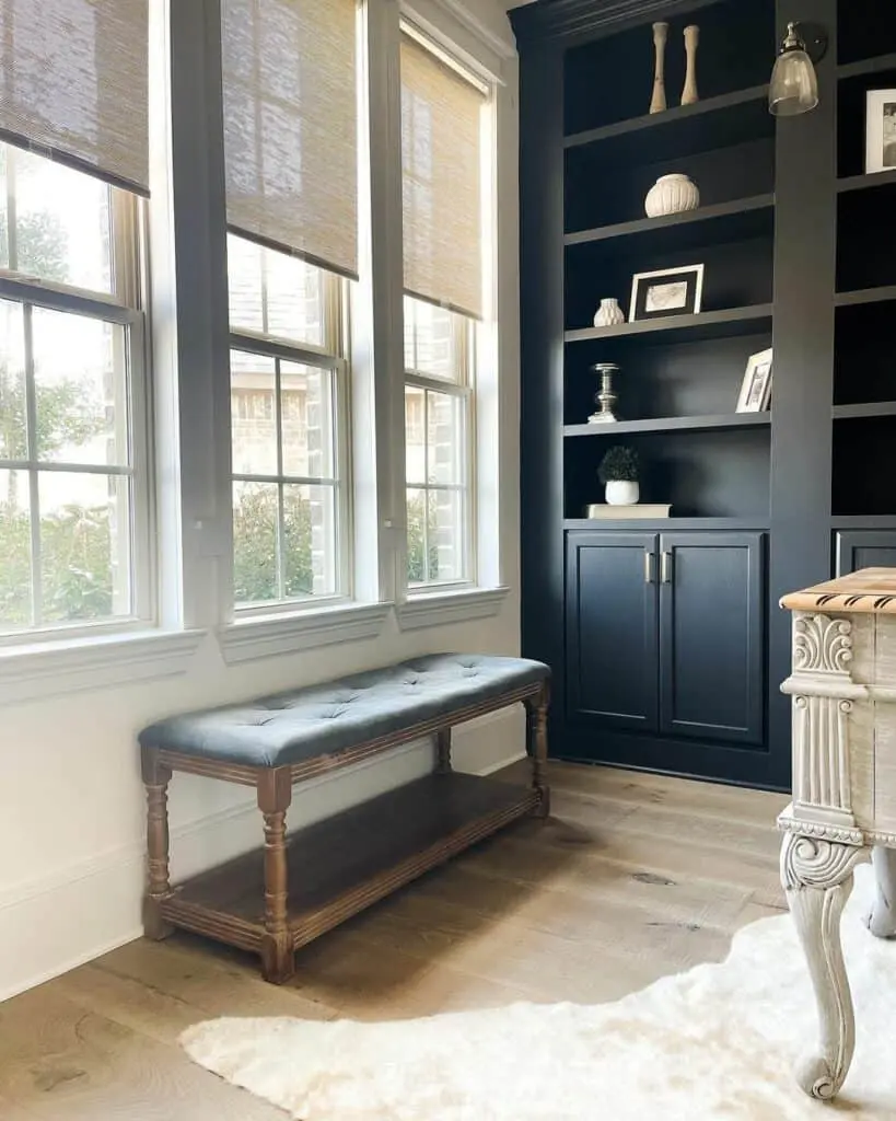 Layered Blinds Coupled with Sleek Black Built-ins