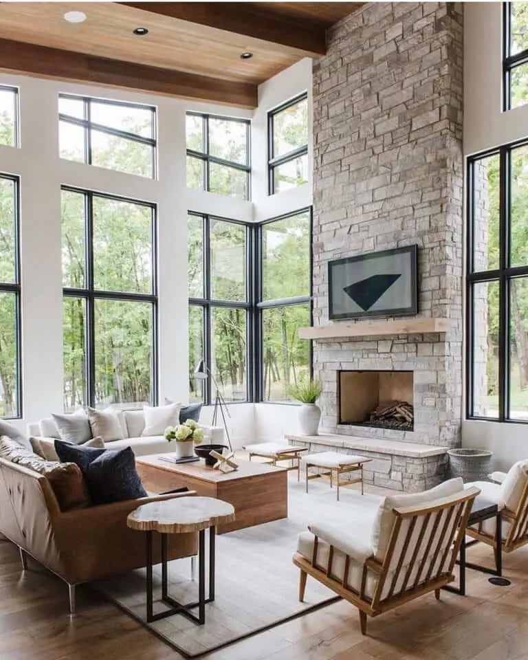 Sleek Sophistication: Living Room with Floor to Ceiling Stone Fireplace