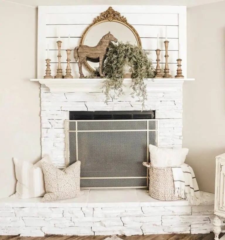 Tranquil Fireside Comfort: White Stone Fireplace Enhanced with Wooden Accents
