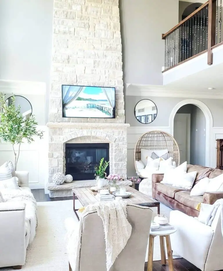 Whitewashed Stone Fireplace in a Luxurious Living Room Setting