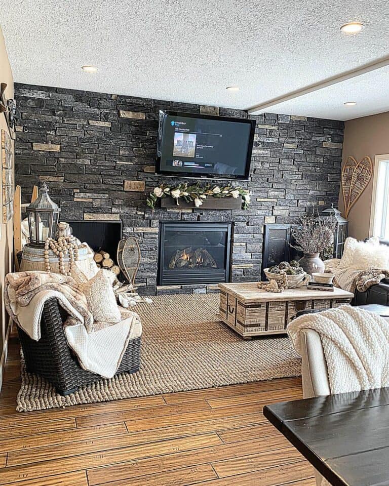 A Rustic Stone Accent Wall with TV and Fireplace