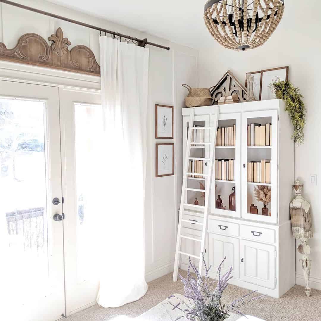 A White Living Room Enhanced by a Repurposed China Cabinet