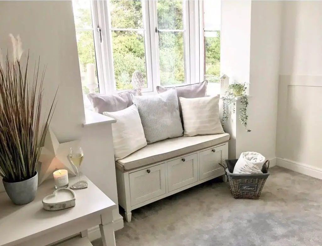 Inviting Bay Window Retreat with White Cushions