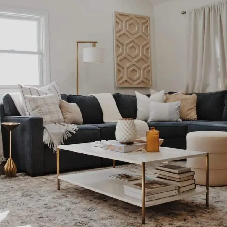 Elegant Navy Blue Sofa with White and Beige Cushions