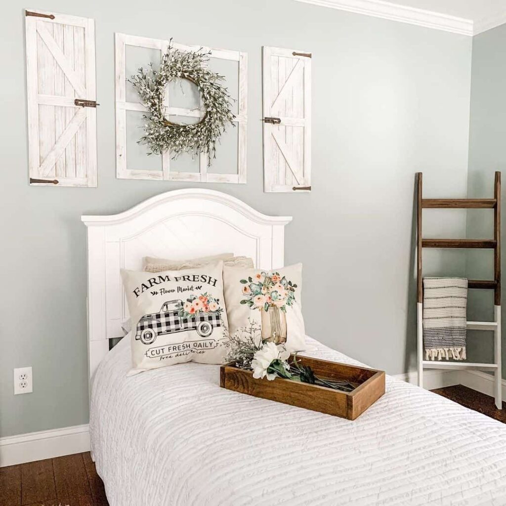 Pastel-green Walls and Farmhouse-inspired Frames in Bedroom