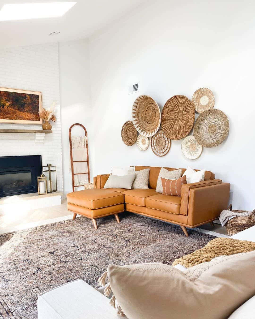 Refresh Your Space with a Brown Leather Couch and Rattan Décor