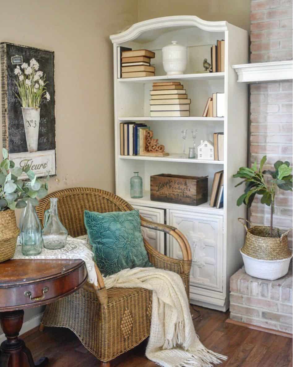 Rustic Brick Fireplace Accompanied by a Vintage White Wood Bookcase