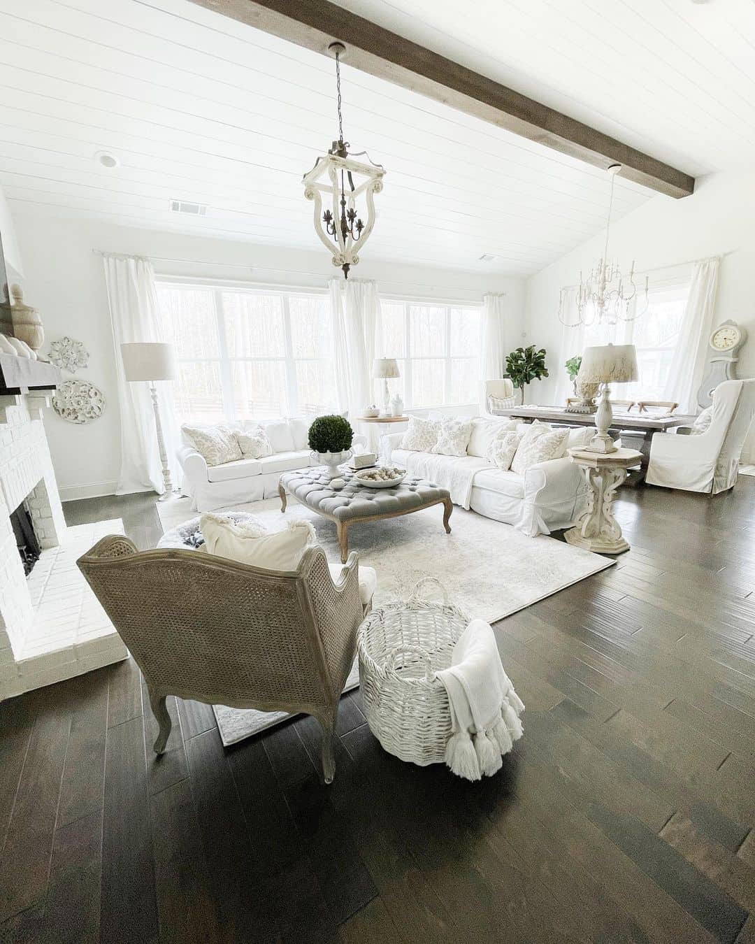 Spacious European Farmhouse Living Room Enhanced by Exposed Wood Beams