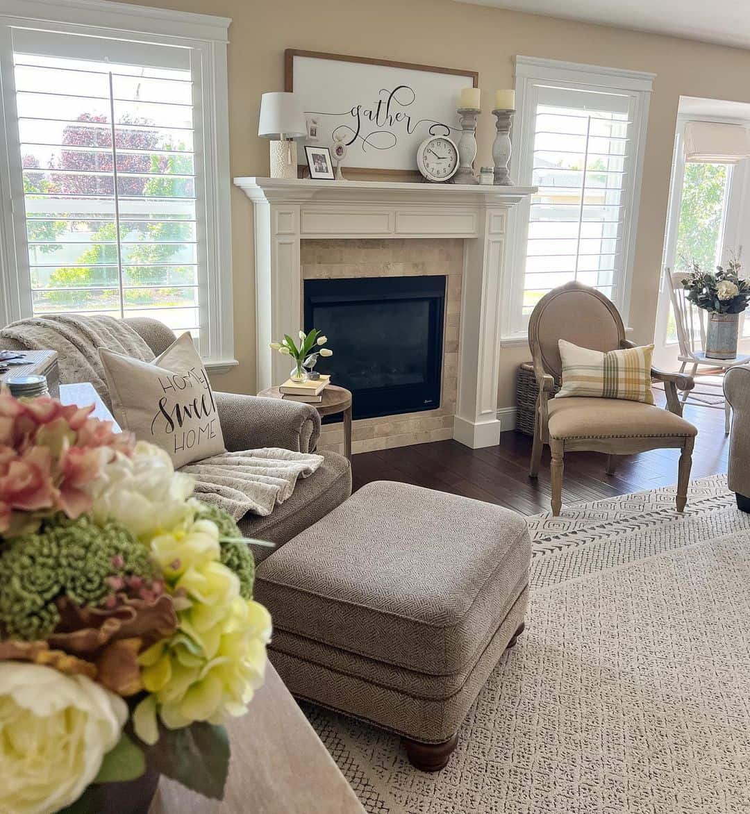 Welcoming Living Room with Soft Cream Walls and Stone Fireplace