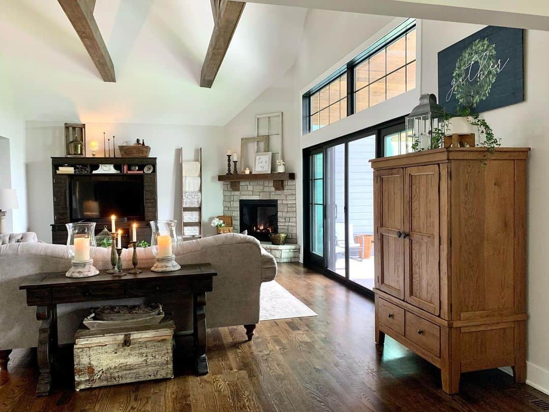 A Living Room Featuring a Gray Couch on Wood Floors