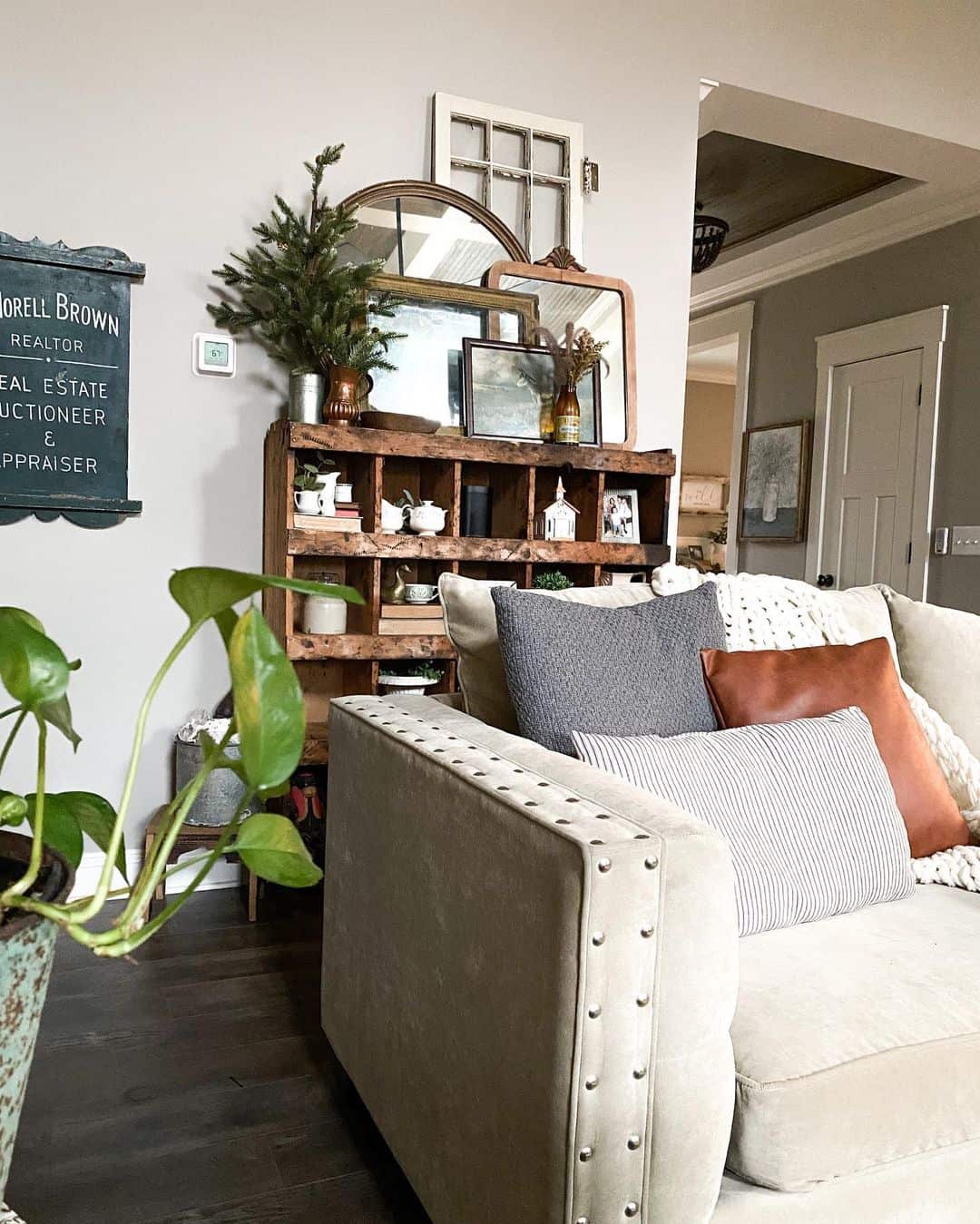 Beige Furniture Paired with Dark Wood Flooring