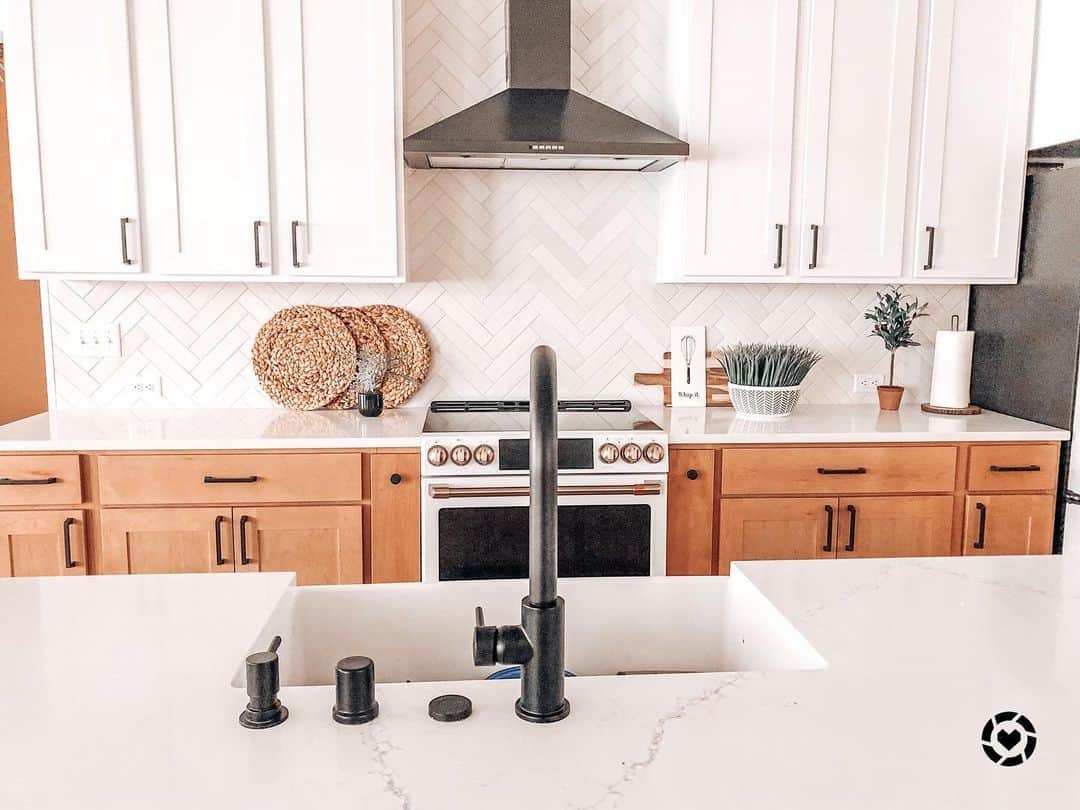 Chic Kitchen with Gray Herringbone Tile Backsplash