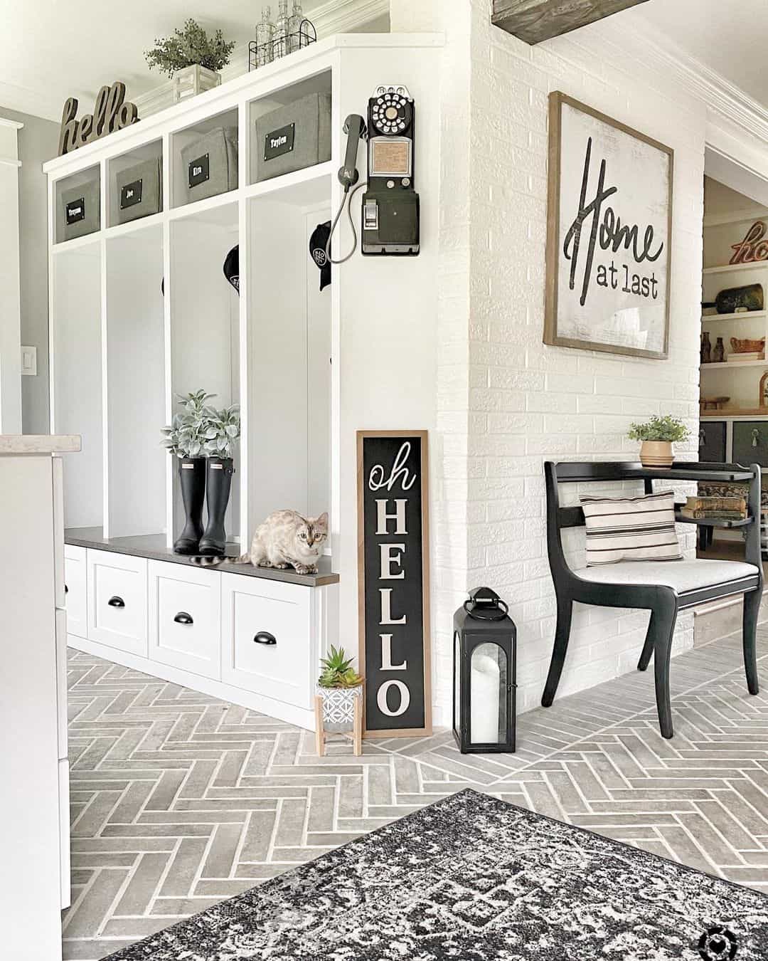 Gray Herringbone Tile Flooring in the Monochromatic Mud Room