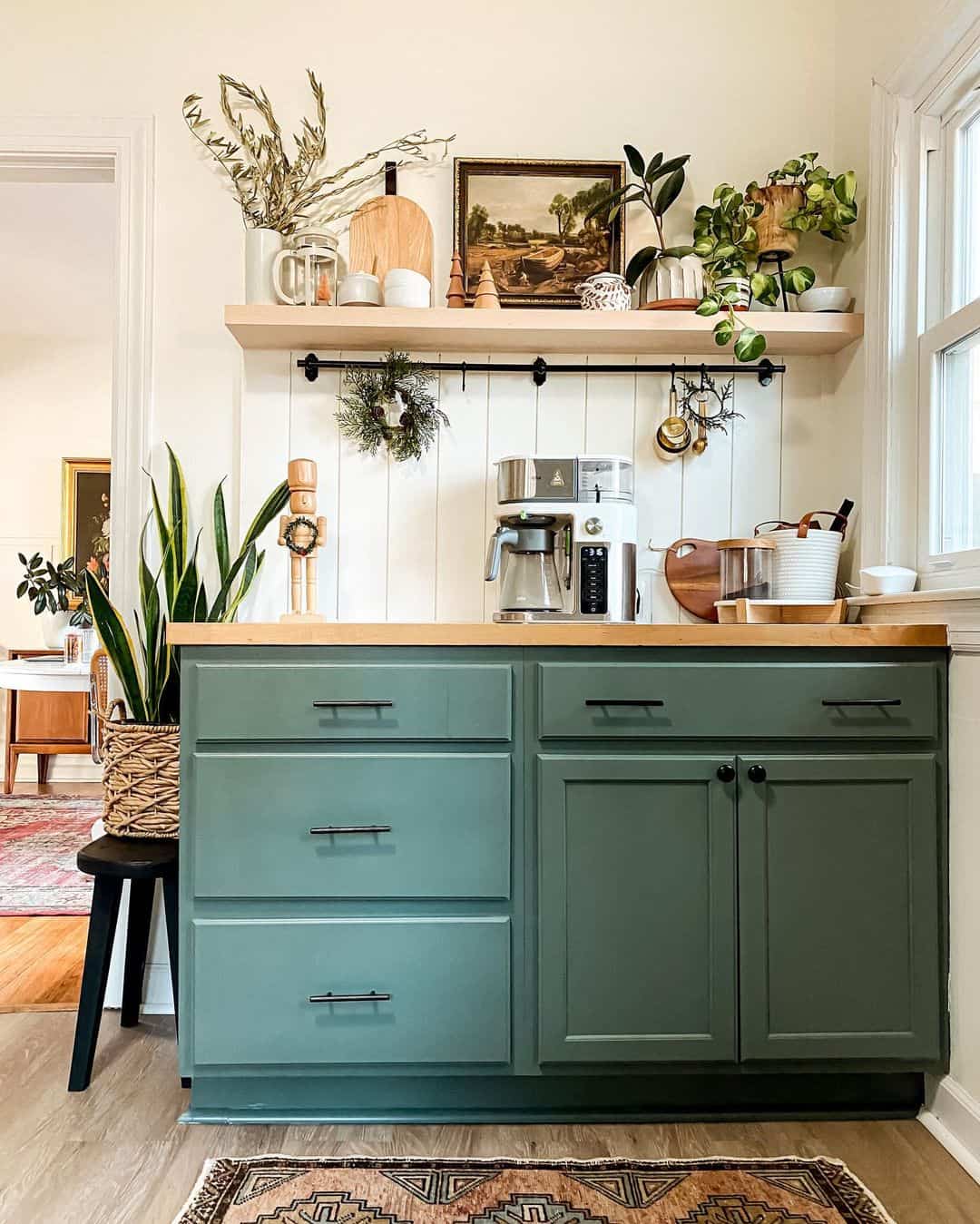 Sage Green Kitchen Enhanced by a Wooden Nutcracker