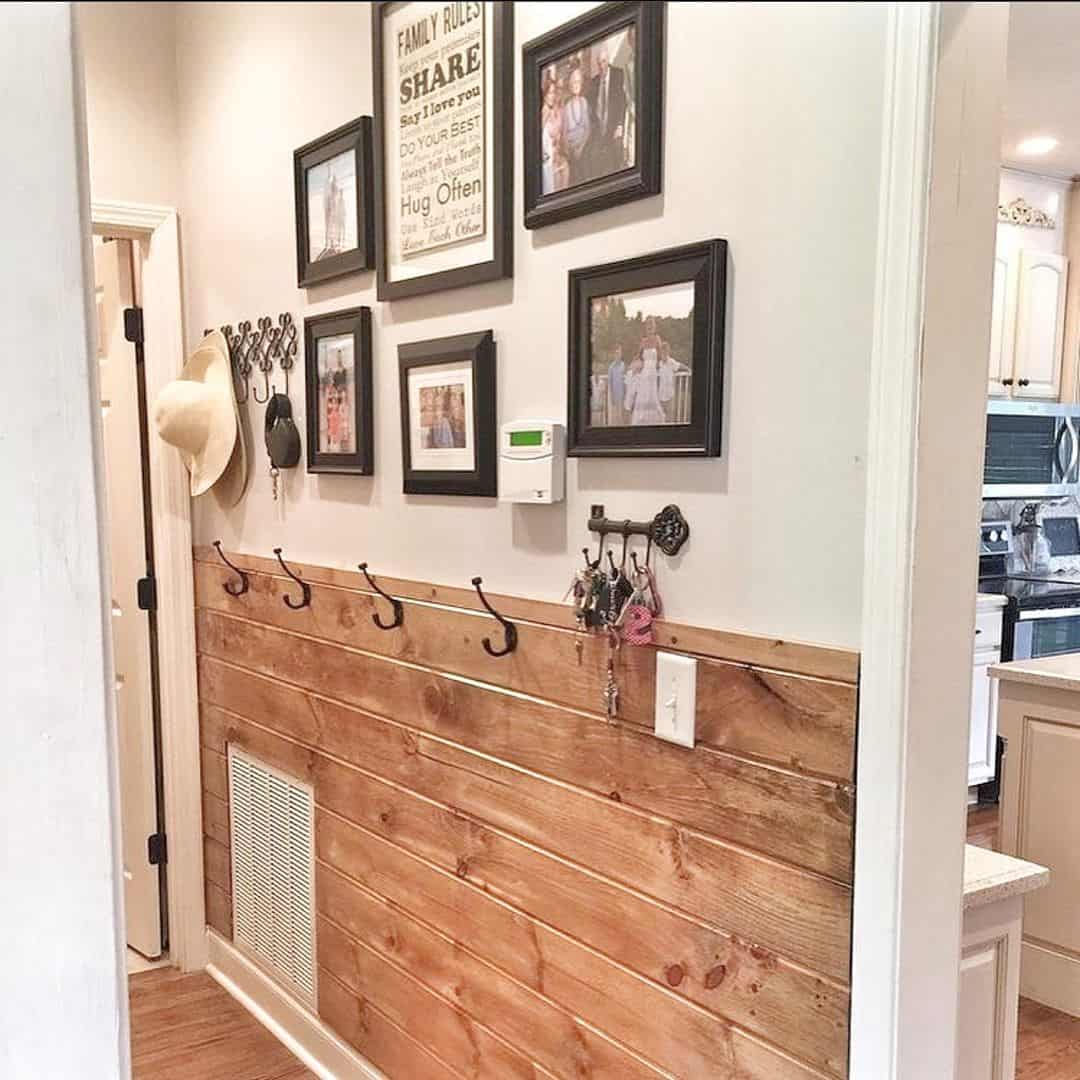 Welcoming Entryway Adorned with Reclaimed Wood Accents and a Gallery Wall