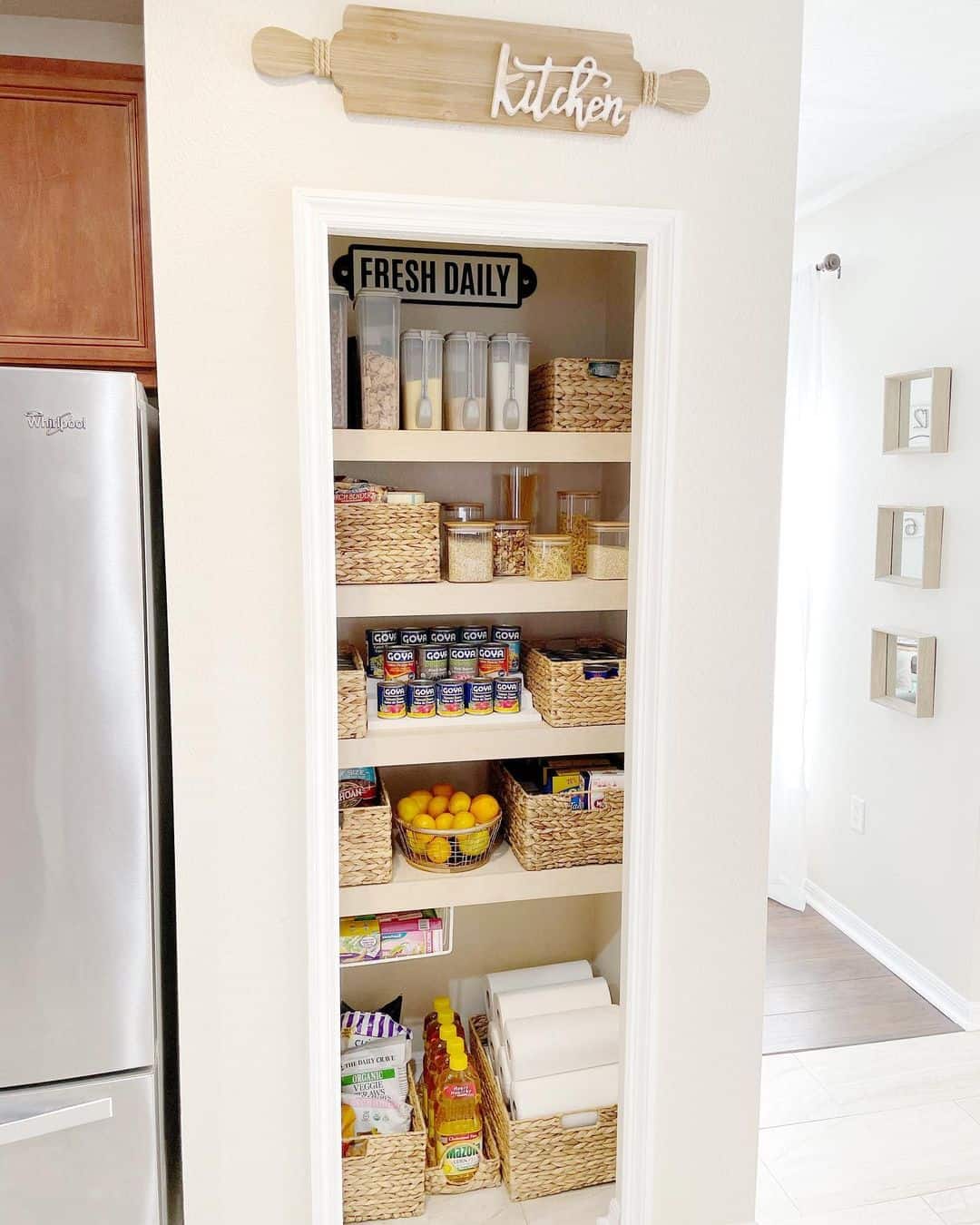 Adorable Compact Pantry with Cream Walls and Rattan Baskets