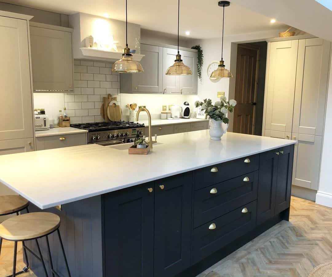 Black Cabinets and Herringbone Flooring