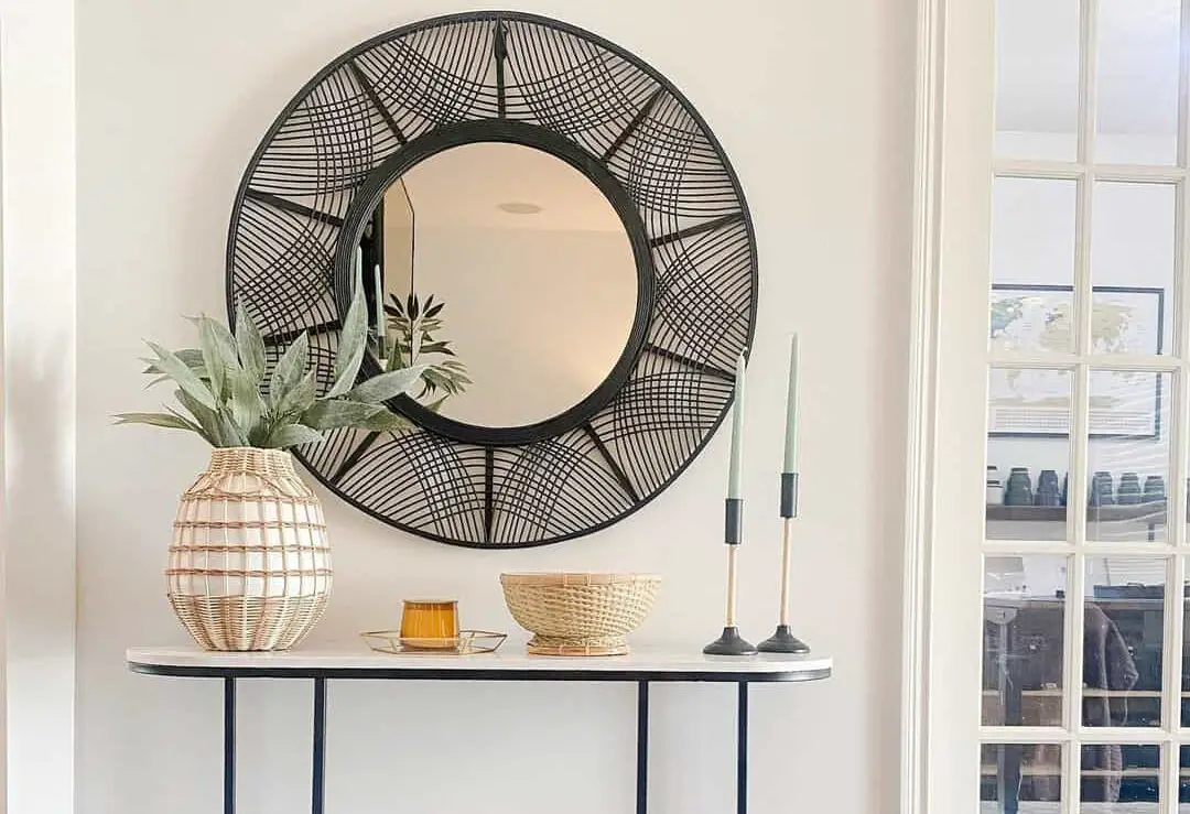 Bold Statements with an Eye catching Entryway Featuring a Black Woven Mirror