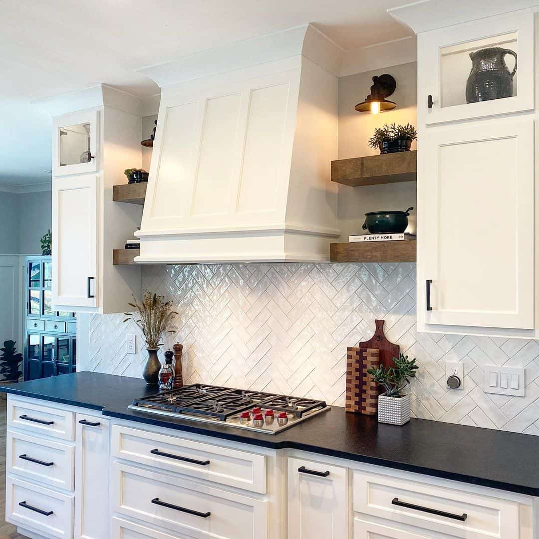 Contrasting White Herringbone Tile Backsplash with Black Hood