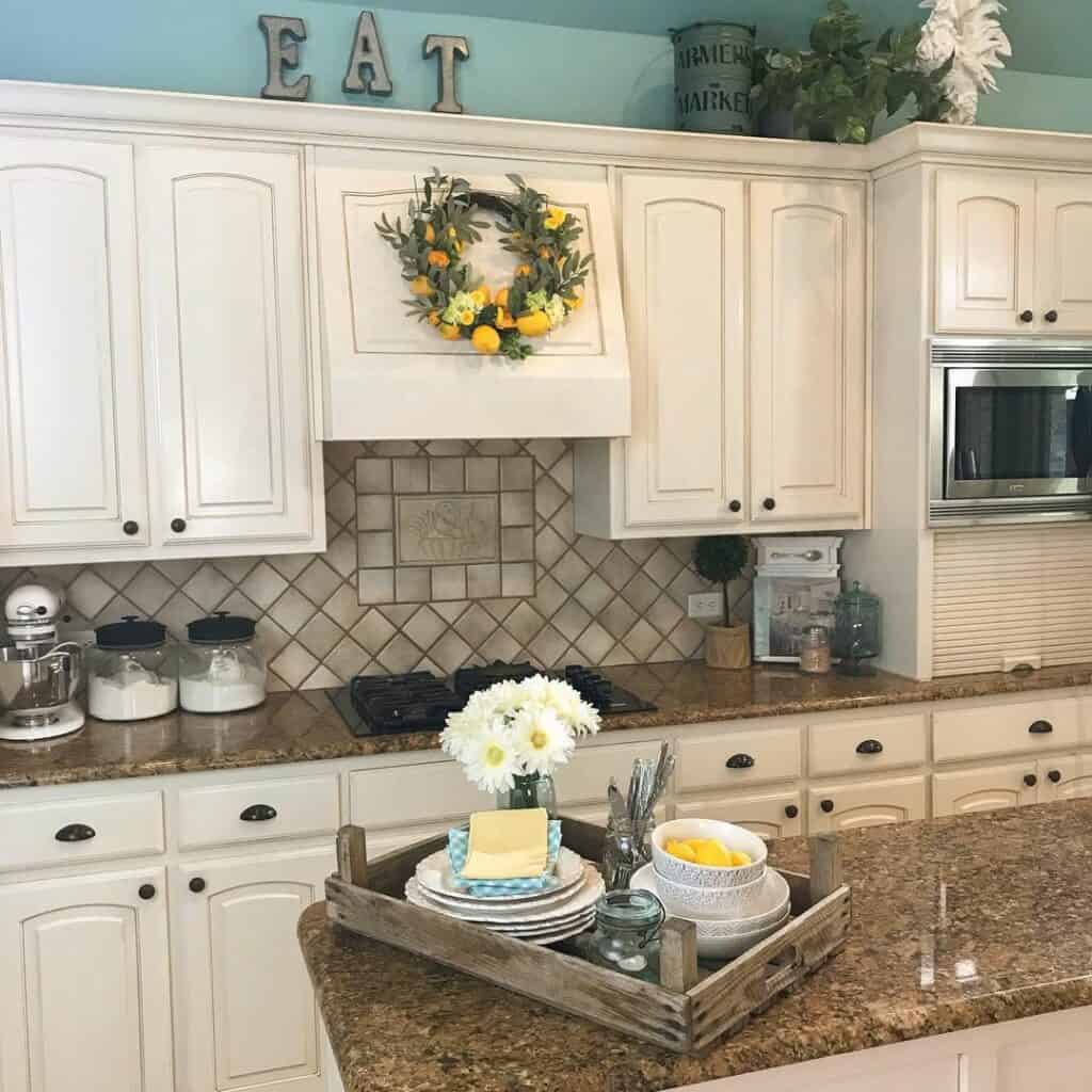 Creamy Cabinets Meet Teal Elegance