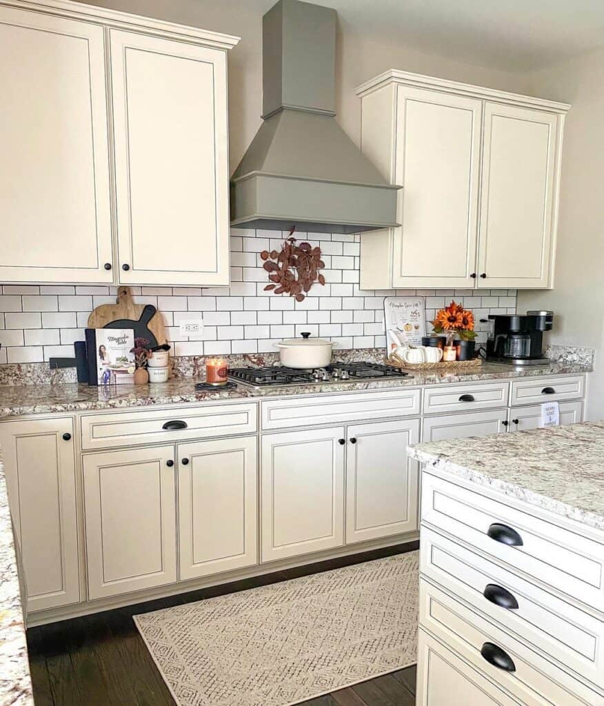 Elegant Black Glazing on Cream Cabinetry