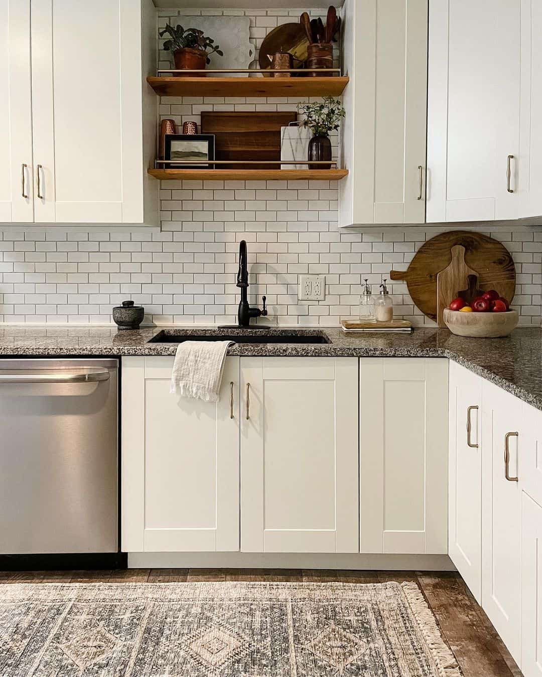 Elegant White Subway Tile Backsplash with Gold Hardware