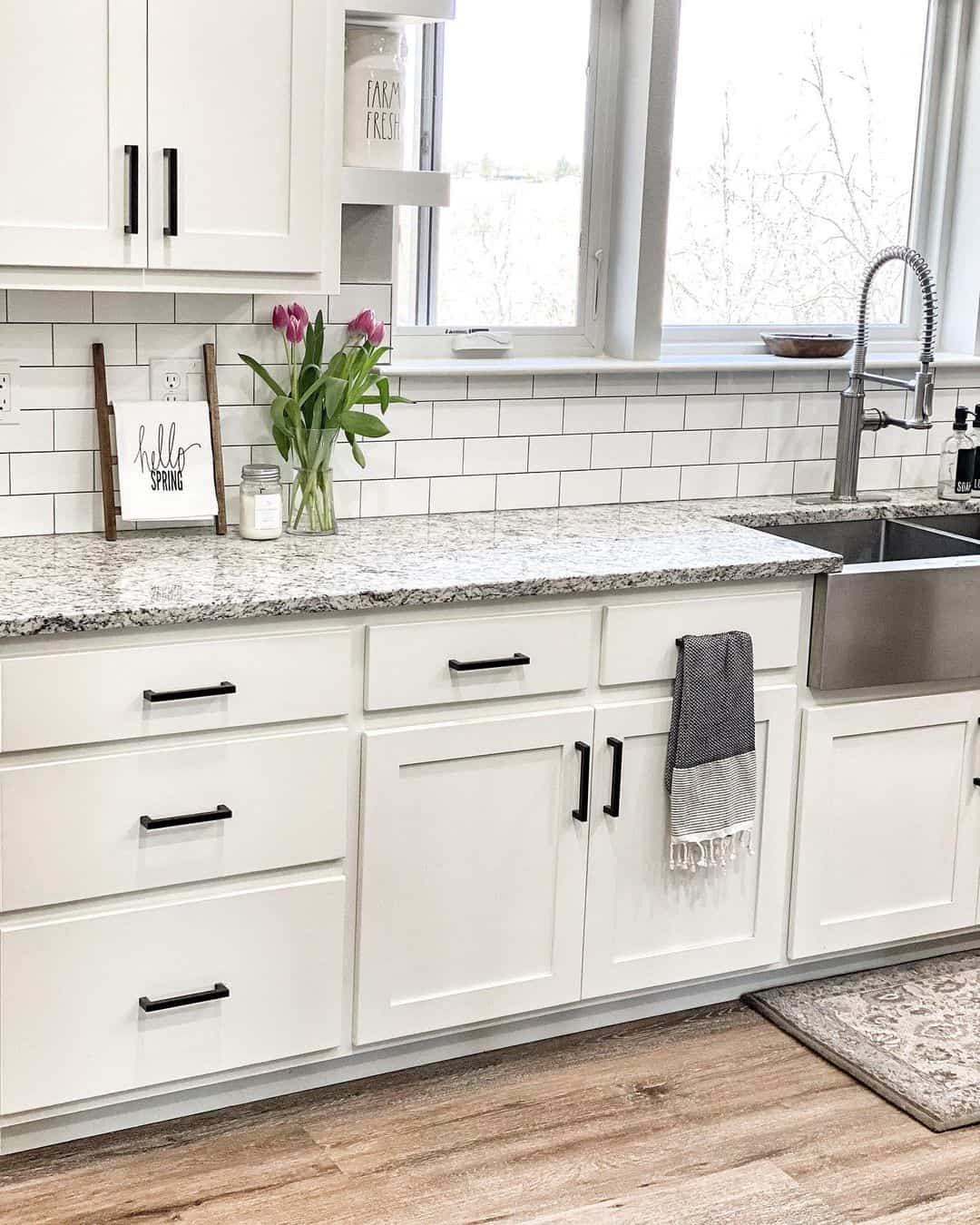 Elevating White Farmhouse Kitchen Cabinets with Black Hardware