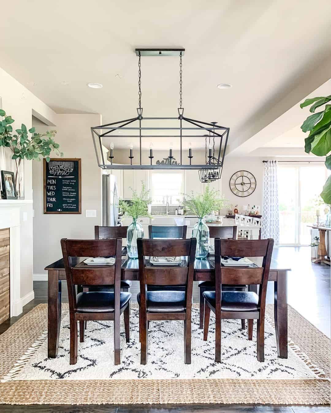 Farmhouse Dining Room with Layered Rugs