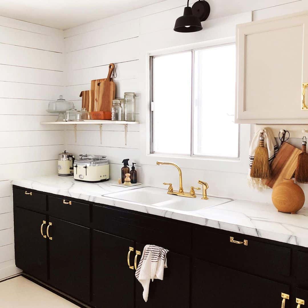 Gold Hardware on Black Cabinets