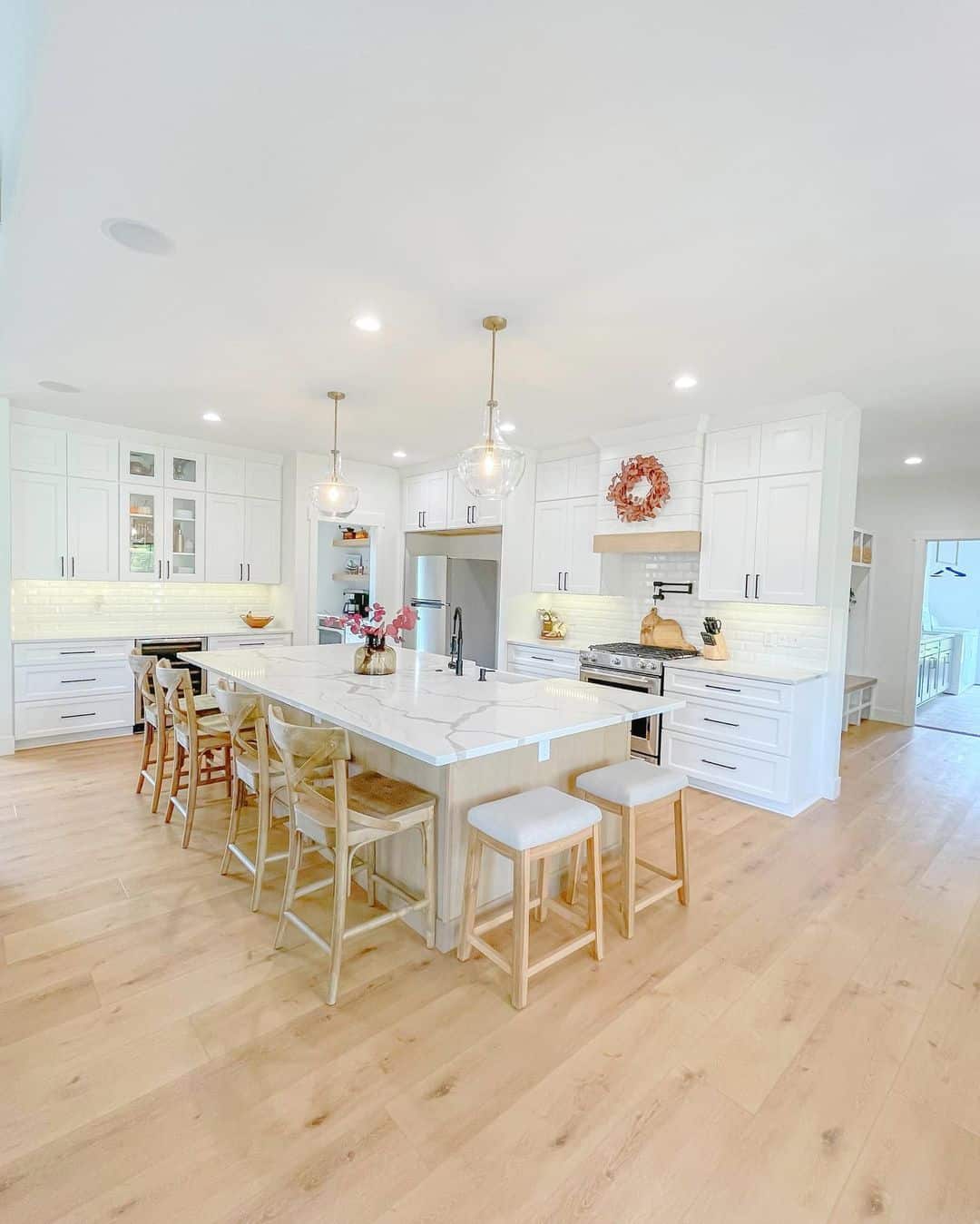 Spacious White Kitchen with Quartz Island Centerpiece