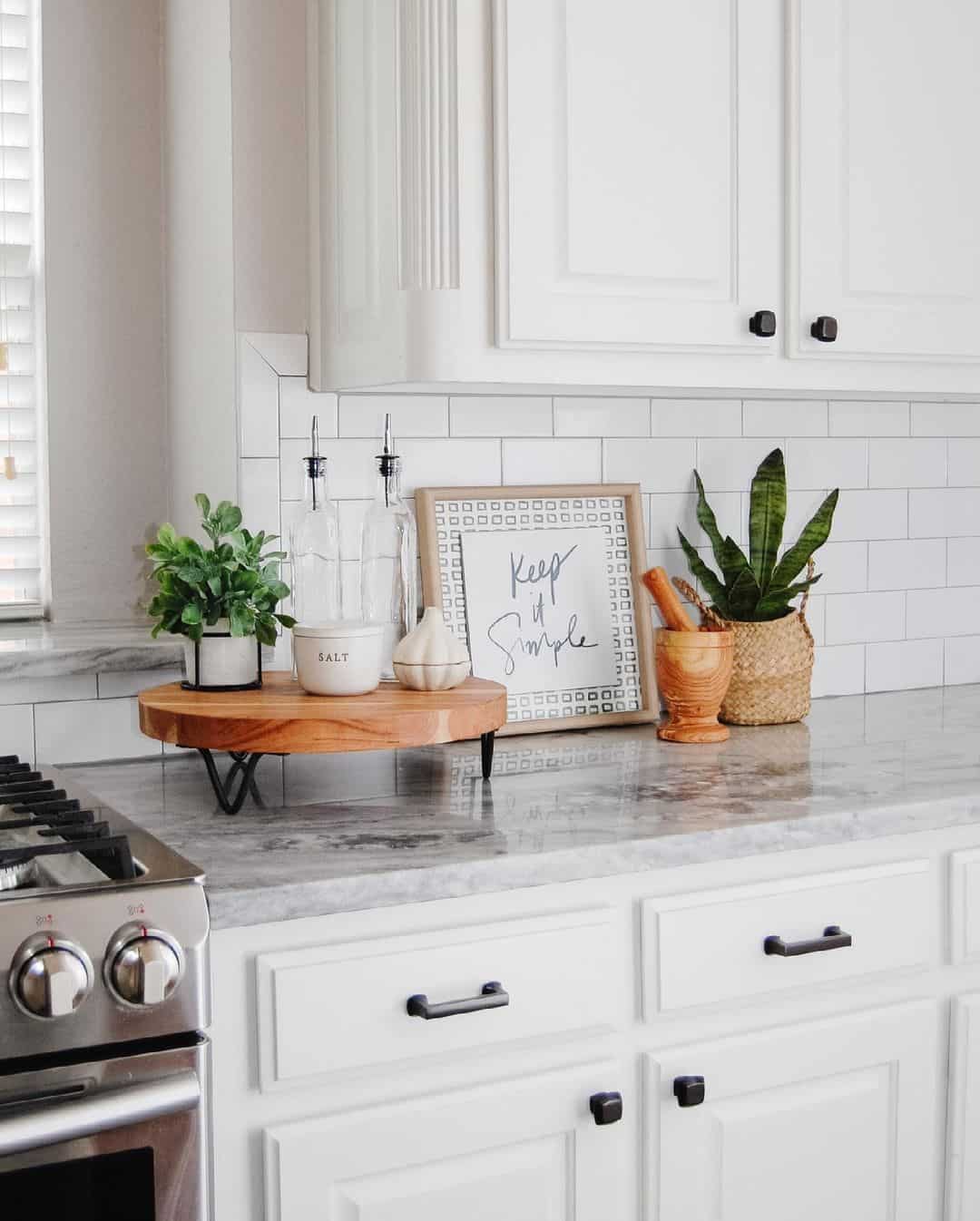 Uncluttered Kitchen Countertop Adorned with Greenery and Wooden Elements