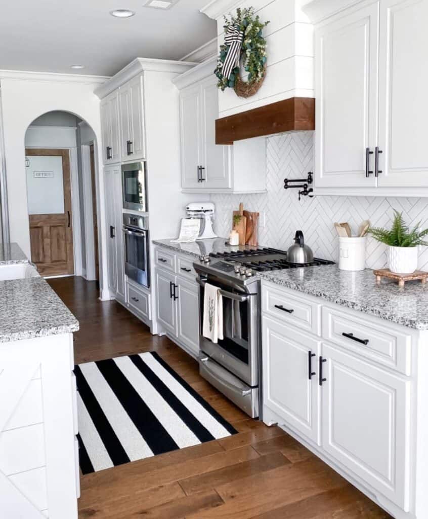 White Cabinets with Herringbone Backsplash