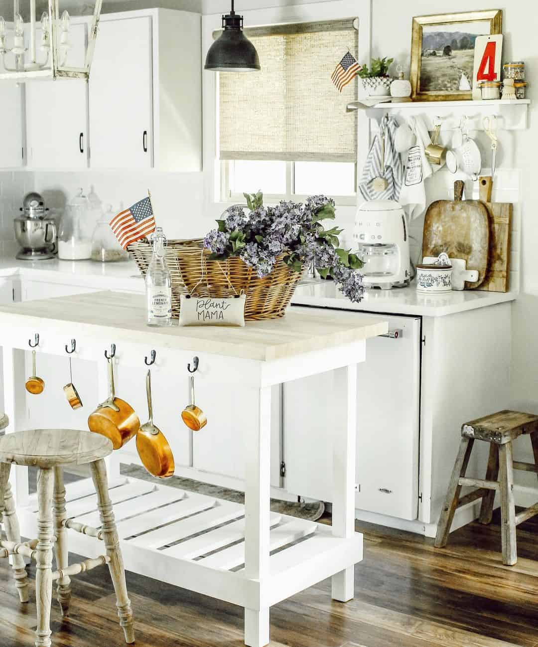 White Kitchen Island Featuring Copper Cookware