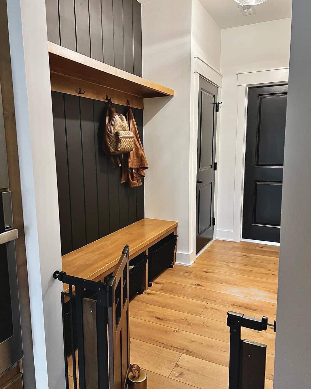 Bold Mudroom Statements: Black and Wood Fusion