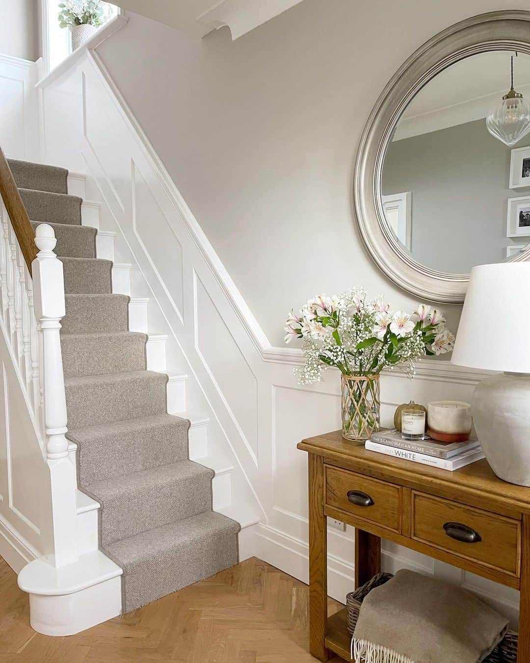 Classic Staircase Beauty: White Wainscoting and Gray Runner