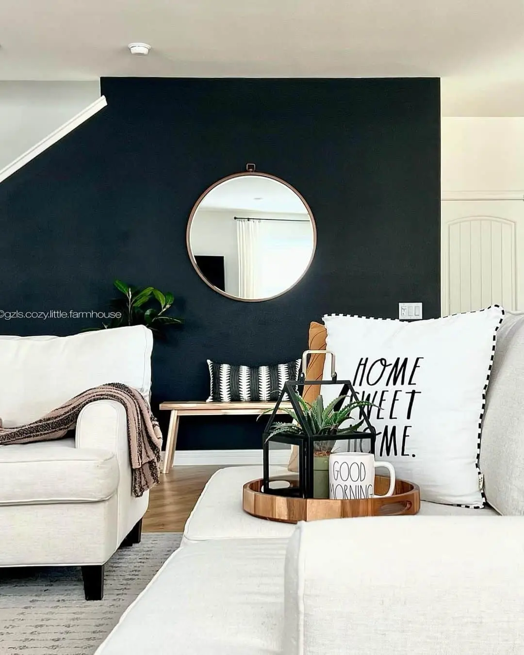 Farmhouse Living Space Featuring White Sofas and Striking Black Accent Wall