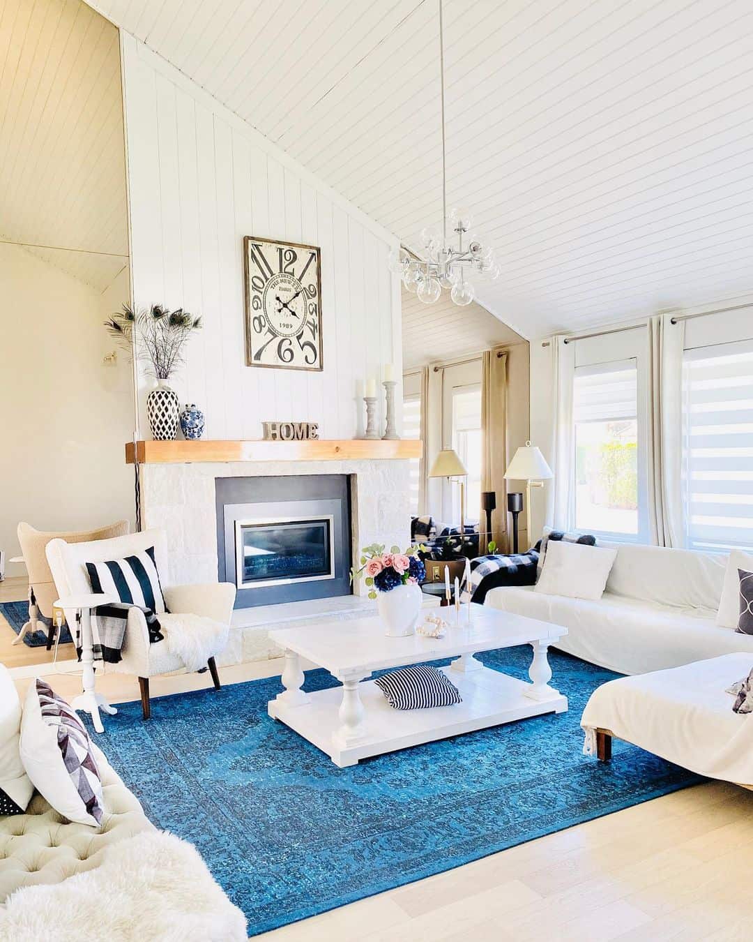 Vibrant Blue Rug Illuminates a White Living Room