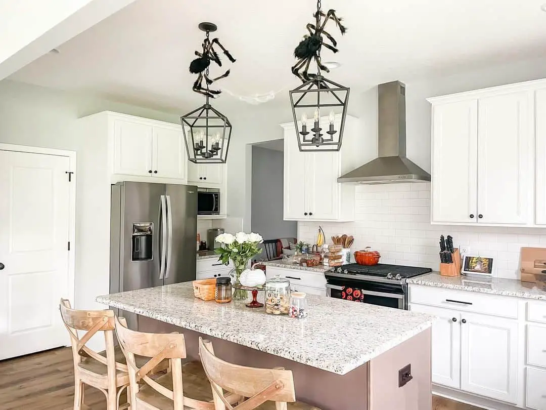 Whimsical Spider Fixtures in a White Culinary Oasis
